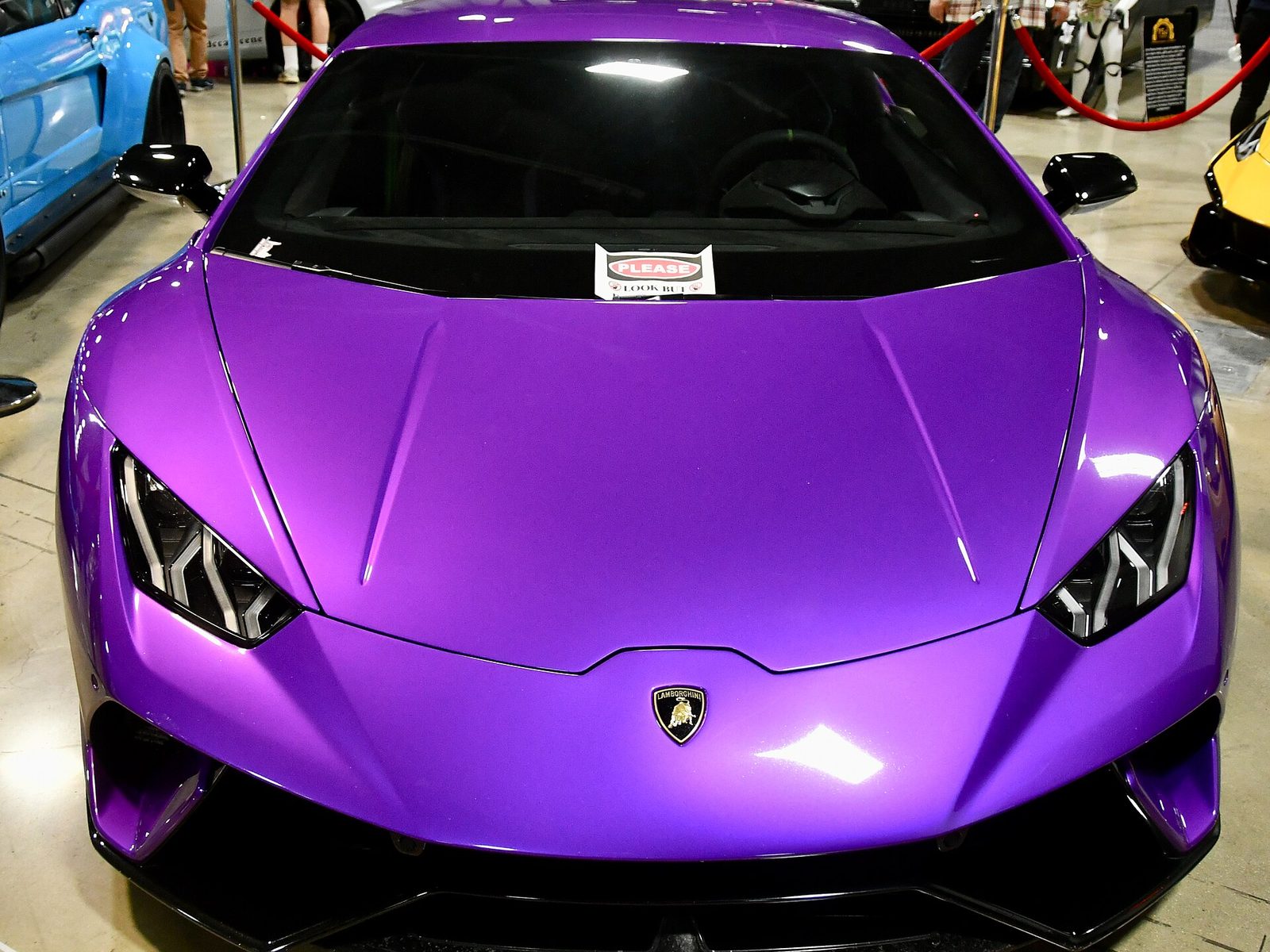 Front of a gloss purple Lamborghini Huracán